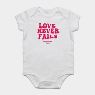 love never fails Baby Bodysuit